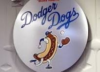 Round Dodger Dogs stadium sign featuring the Dodgers script and a running hot dog character